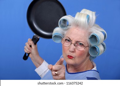 Angry Old Woman With A Frying Pan