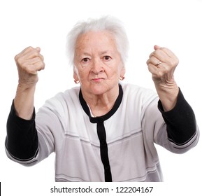 Angry old woman making fists on white background