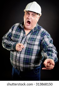 Angry overweight construction worker screaming and pointing at something