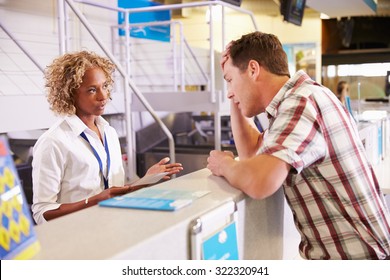 Angry Passenger Complaining To Staff At Airport Check In