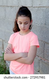 Angry Preteen Girl With Pink T-shirt In The Street