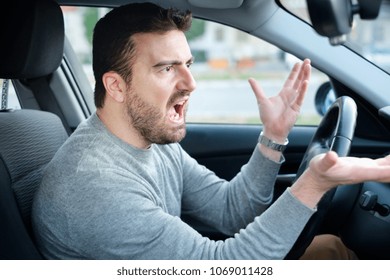 Angry And Rude Driver Portrait Sitting In His Car