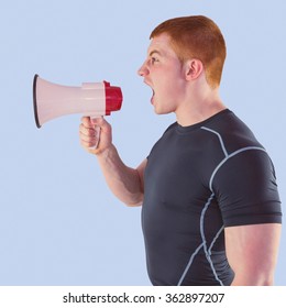 Angry Rugby Player Yelling Through The Megaphone Against Blue Background