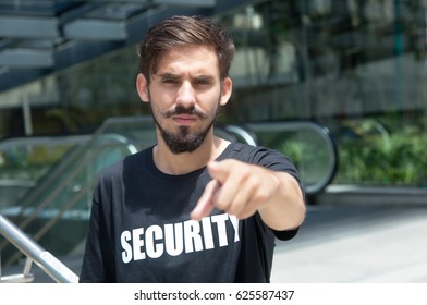 Angry security guard safes the entrance