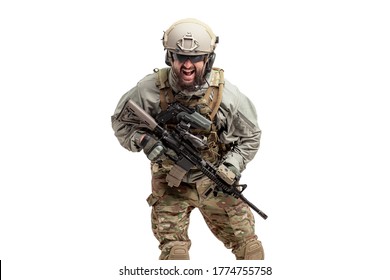 Angry Soldier In Military Equipment With A Gun Screaming On A White Isolated Background, A Commando In Uniform With A Rifle Attacks In A Rage