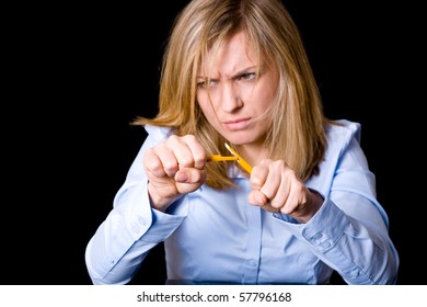 angry and stressed blonde businesswoman in blue shirt, studio shoot isolated on black background - Powered by Shutterstock