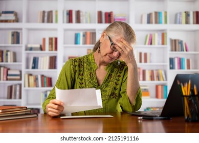 Angry Stressed Businesswoman Opening Envelope Reading Bad News In Mail Letter. Mad Female Feels Frustrated High Bills, Dismissal Notice, Bank Debt, Tax Invoice Or Mistake Sits At Home Office Library.