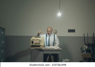 Angry Stressed Office Worker Hitting His Outdated Broken Computer