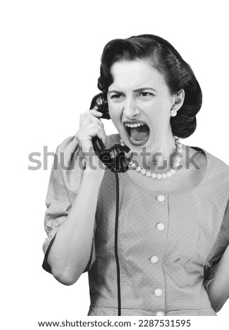 Angry stressed woman having a phone call, she is yelling on the receiver