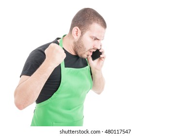 Angry Supermarket Employee Yelling At Telephone Isolated On White Background With Copy Space Area