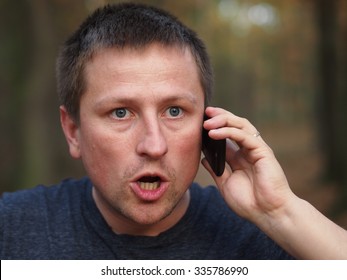 Angry Surprised Man With A Smartphone.