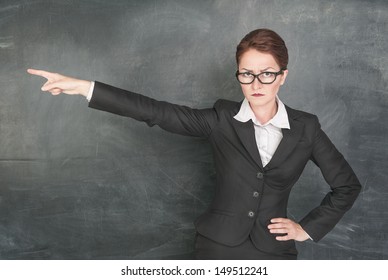 angry-teacher-glasses-pointing-out-260nw-149512241.jpg