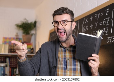 Angry Teacher Pointing With Finger In Classroom