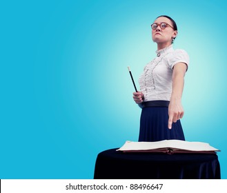 Angry Teacher Pointing On The Book/Angry Teacher