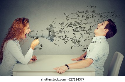 angry teacher woman with megaphone shouting at stressed scared student blown away by wave of science math formulas. Negative human emotions   - Powered by Shutterstock