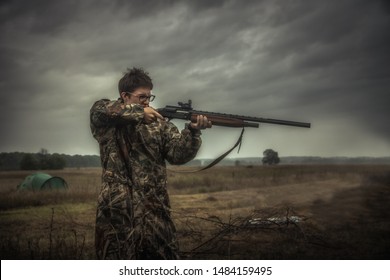 Angry Teenager Boy Shooting Gun During Duck Hunting Season