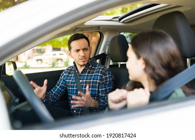 Angry And Upset Father Having A Fight With Her Teen Daughter Because She Almost Caused A Car Crash While Driving His Car During Her Lessons