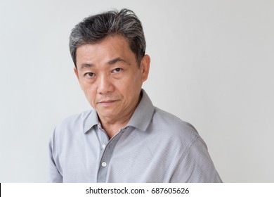 Angry, Upset, Unhappy, Frustrated, Unfriendly Middle Age Old Asian Man Looking At You