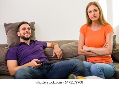 Angry Wife And Husband Are Having Conflict Because Husband Is Watching Tv Too Much.