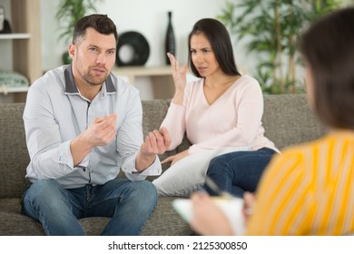 Angry Wife And Sad Husband During Marriage Psychotherapy With Counselor