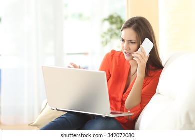 Angry Woman Calling To Customer Service With A Laptop Failure