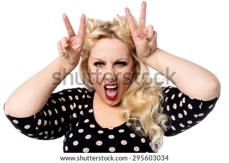 Angry woman with characteristic hand gesture