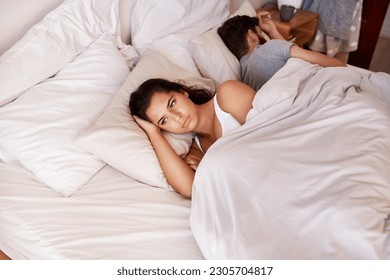 Angry woman, couple and fight in bed in the morning feeling frustrated from divorce talk. Marriage problem, conflict and fighting in a bedroom at home with anger argument and communication issue