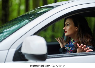 Angry Woman Driver With Road Rage Yelling At Someone