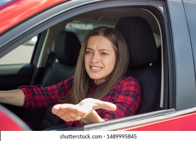 Angry Woman Driver Screaming In The Car. The Quarrel And Dissatisfaction On The Way.