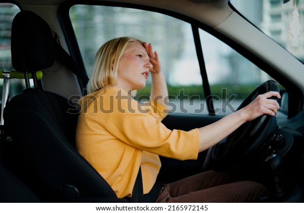 Angry woman driving a\
car