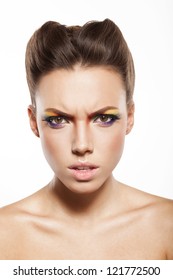 Angry Woman Is Looking At Camera, Beautiful Female Face With Rainbow Makeup.