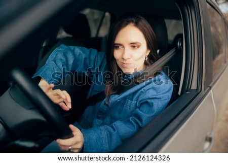 
Angry Woman Pressing the Honk while Driving. Stressed driver being rude beeping and making noises in heavy traffic
