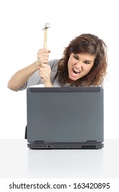 Angry Woman Ready To Destroy A Computer With A Hammer Isolated On A White Background