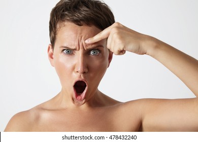 Angry Woman Shows Wrinkle On A Forehead