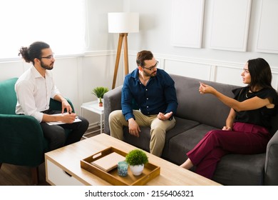 Angry Woman Taking Out Her Ring And Asking For Divorce To Her Husband While Fighting During Couples Therapy