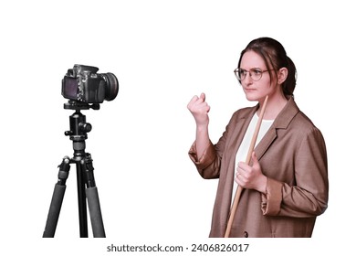Angry woman teacher with camera on tripod leads online school on isolated on a white background, copy space