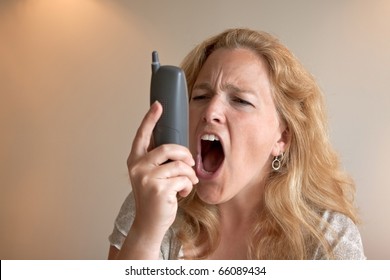 An Angry Woman Yelling Into Her Phone.