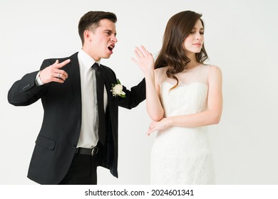 I'm So Angry With You. Upset Husband In A Black Suit Shouting To Her Annoyed Bride On Their Wedding Ceremony