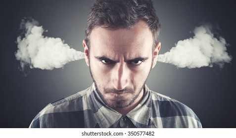 Angry young man, blowing steam coming out of ears, about to have nervous atomic breakdown. Negative human emotions, facial expressions, feelings, attitude