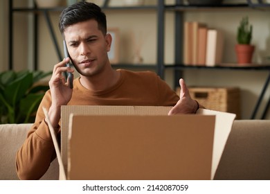 Angry Young Man Calling To Delivery Service After Receiving Wrong Package