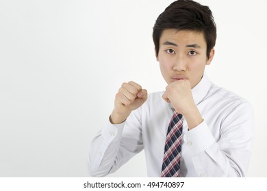 Angry young man clenching his fists - Shutterstock ID 494740897
