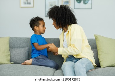 Angry Young Mother Arguing With Little Son Who Is Misbehaving By Being Stubborn While Talking To Him. The Concept Of The Conflict Of Parents And Children