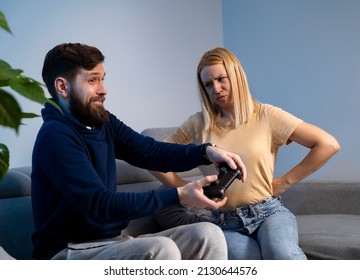 Angry Young Wife Angry At Her Husband Or Boyfriend For Being Lazy And Playing Video Games All Day 