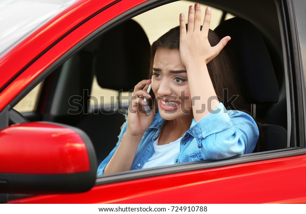 Angry young woman in\
car