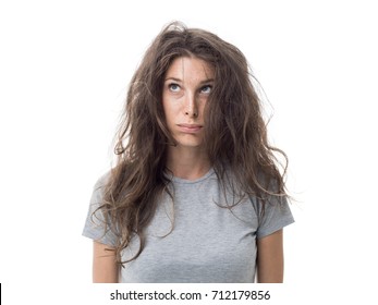 Angry Young Woman Having A Bad Hair Day, Her Long Hair Is Messy And Tangled