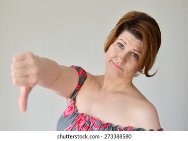 Angry Young Woman Showing Her Thumb Down