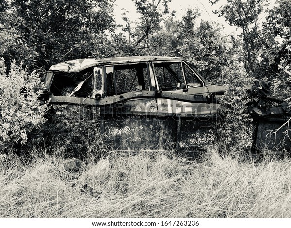 Anguilla, Caribbean - January 13\
2020:Police car abandoned in the jungle of the Caribbean\
island