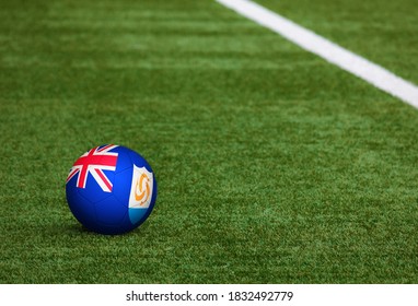 Anguilla flag on ball at soccer field background. National football theme on green grass. Sports competition concept. - Powered by Shutterstock