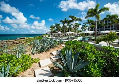 Anguilla Island, Anguilla British West Indies - December 3, 2015 Four Season Resort Pools And Gardens Over A Cliffs With Barnes Bay View. 