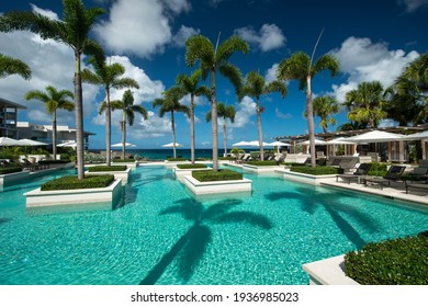 Anguilla Island, Anguilla British West Indies - December 3, 2015 Four Season Resort Pools And Gardens Over A Cliffs With Barnes Bay View. 